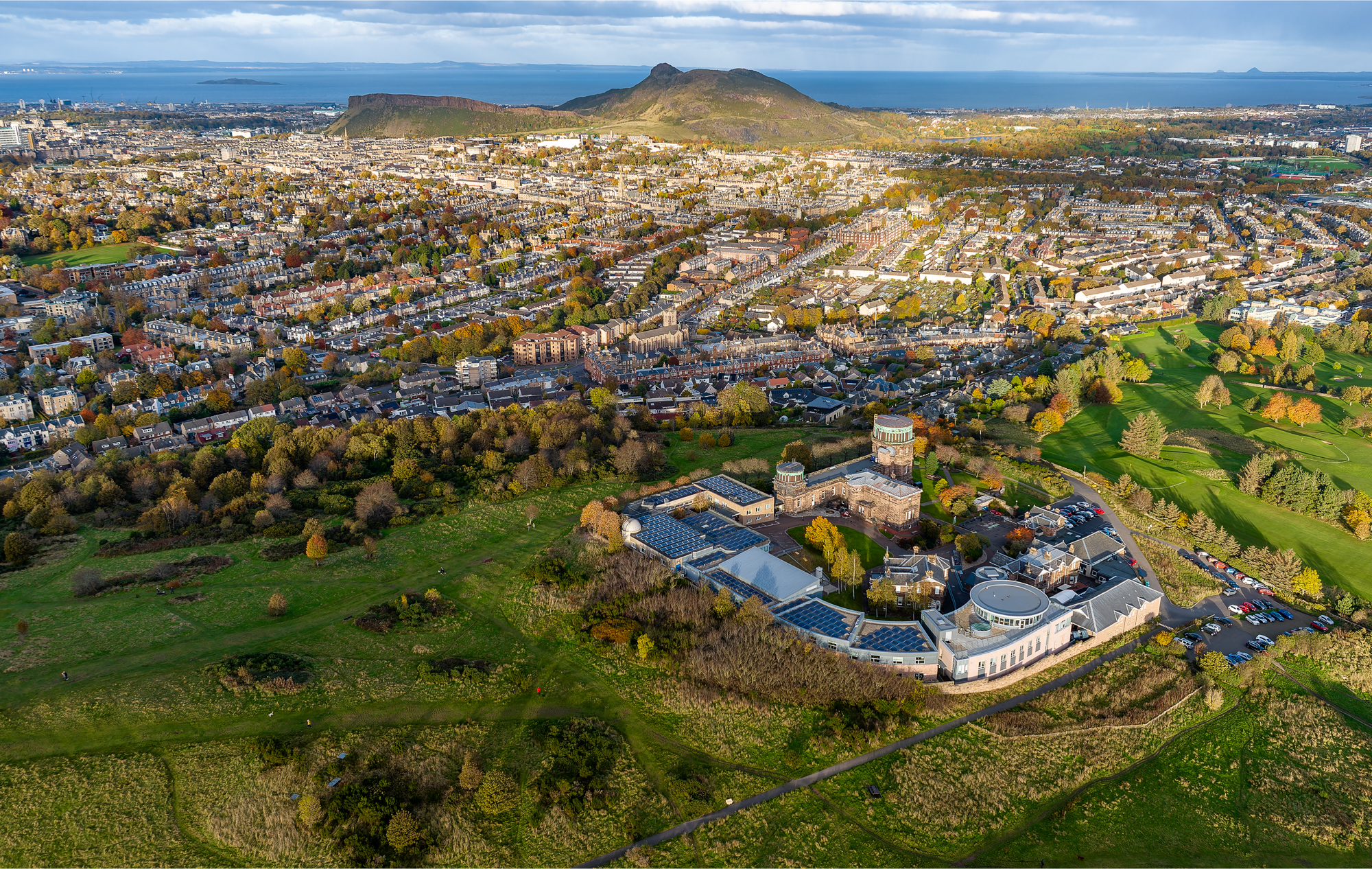 Drone photo over Blackford Hill looking North East over the Royal Observatory towards Arthur's Seat.